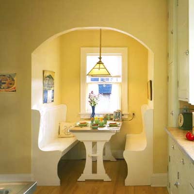 Built-in seating area with two benches and a table.