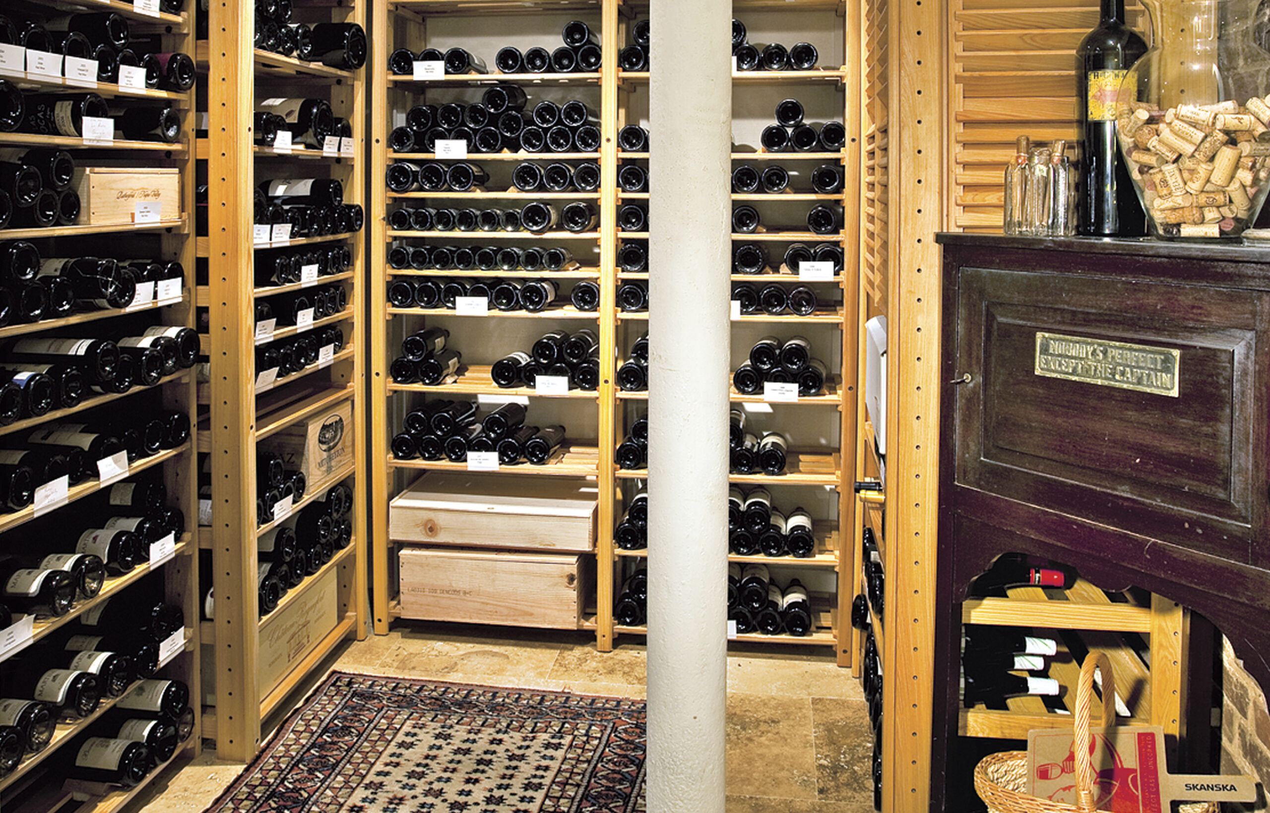 A home wine cellar located in the basement of a home.