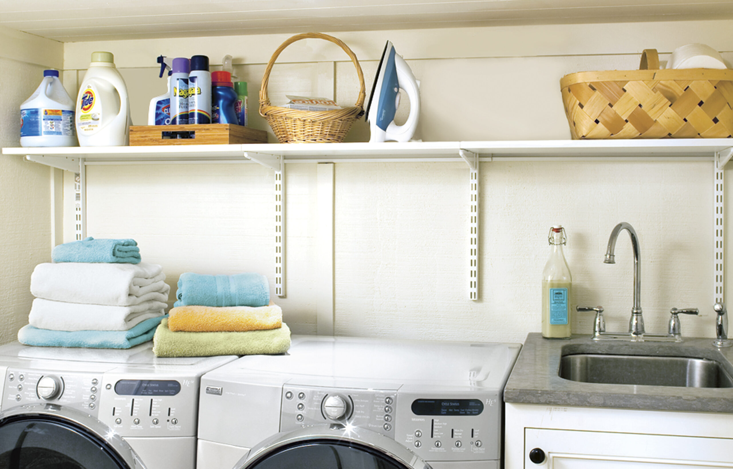 Shelving installed for extra storage in the basement laundry room.