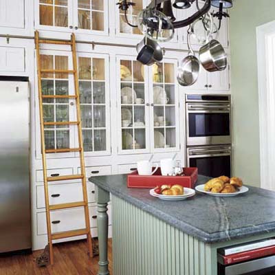 Rolling ladder installed in a kitchen.