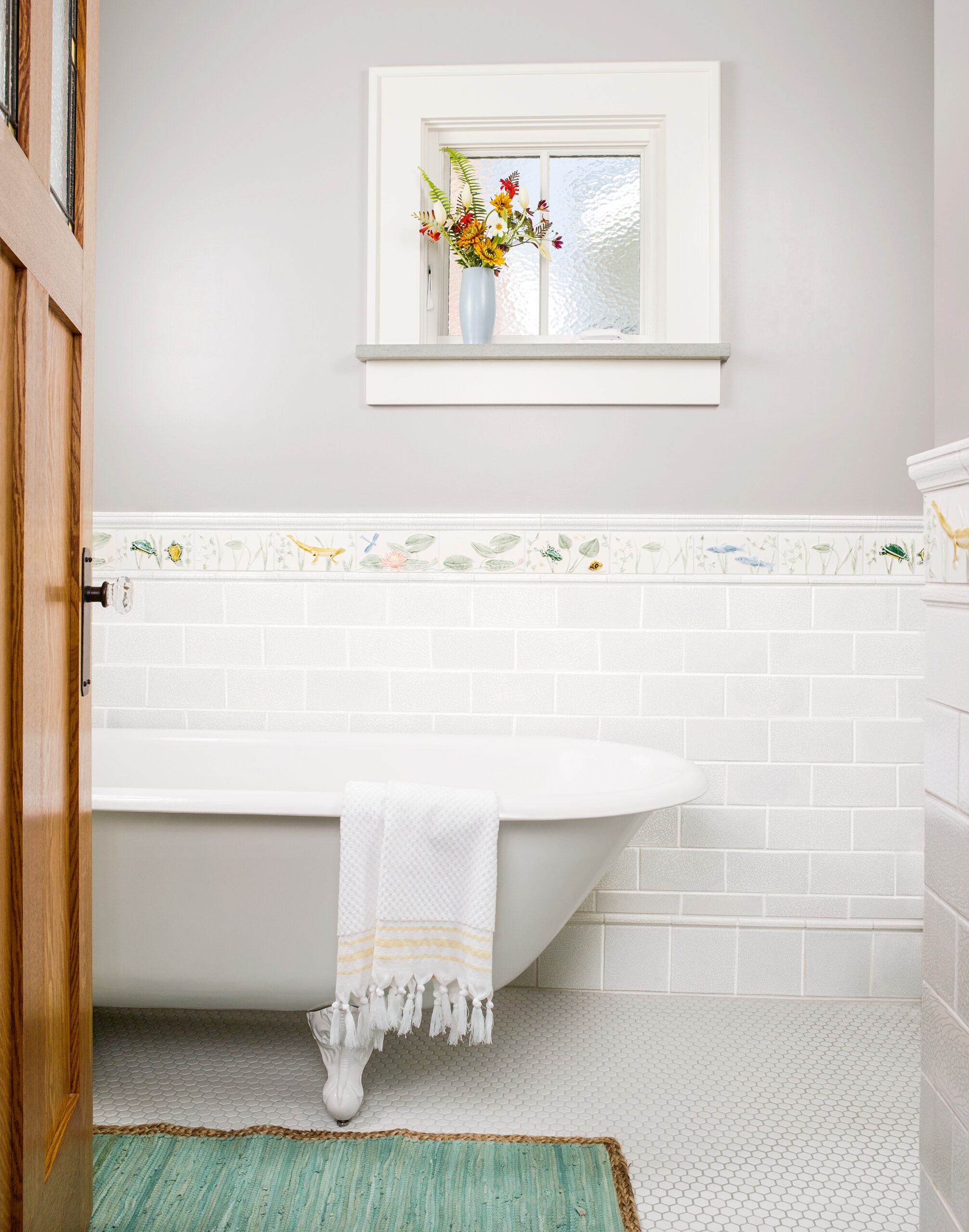 An enlarged bathroom with a bathtub.