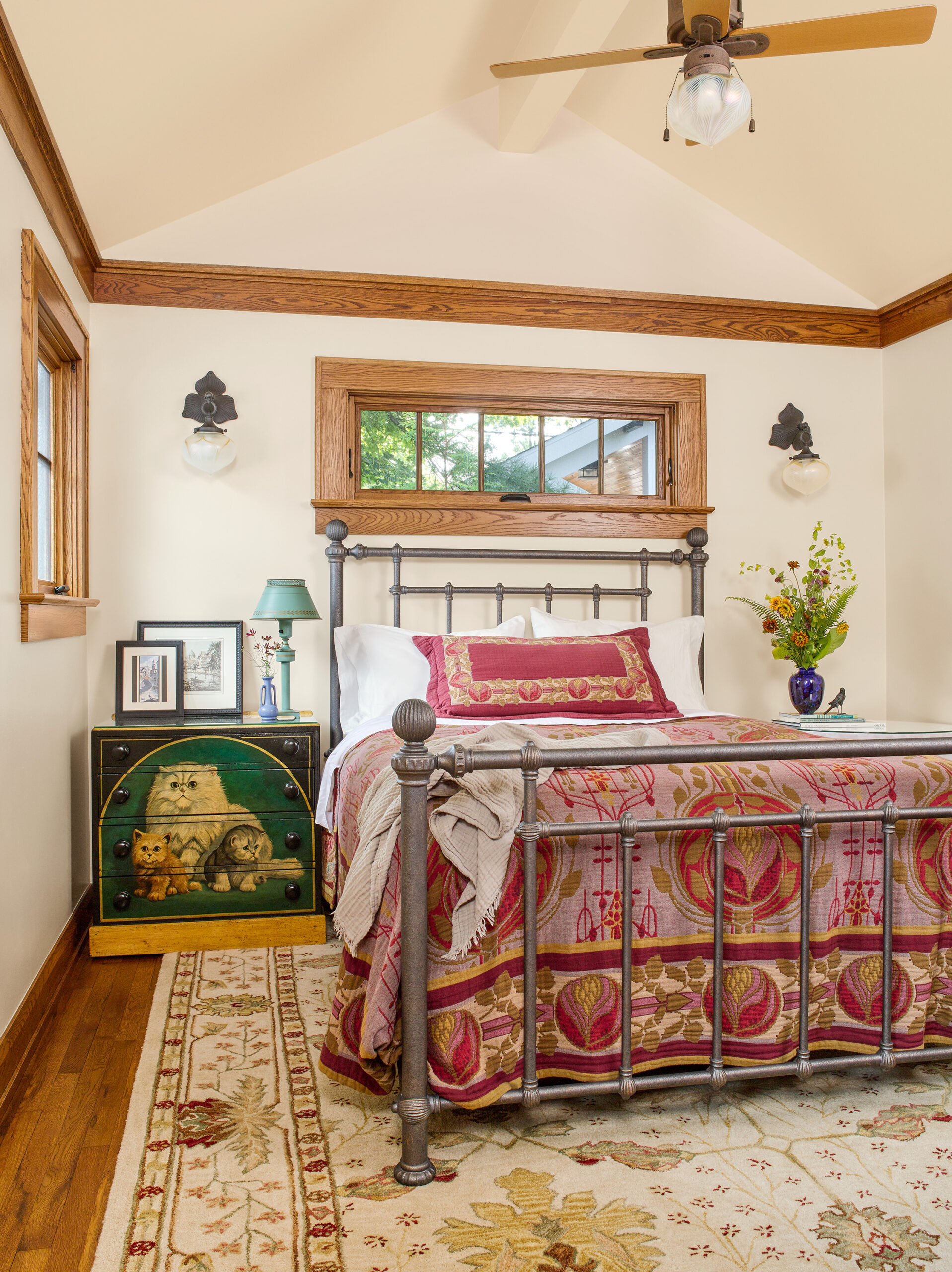Master bedroom with a cathedral ceiling.