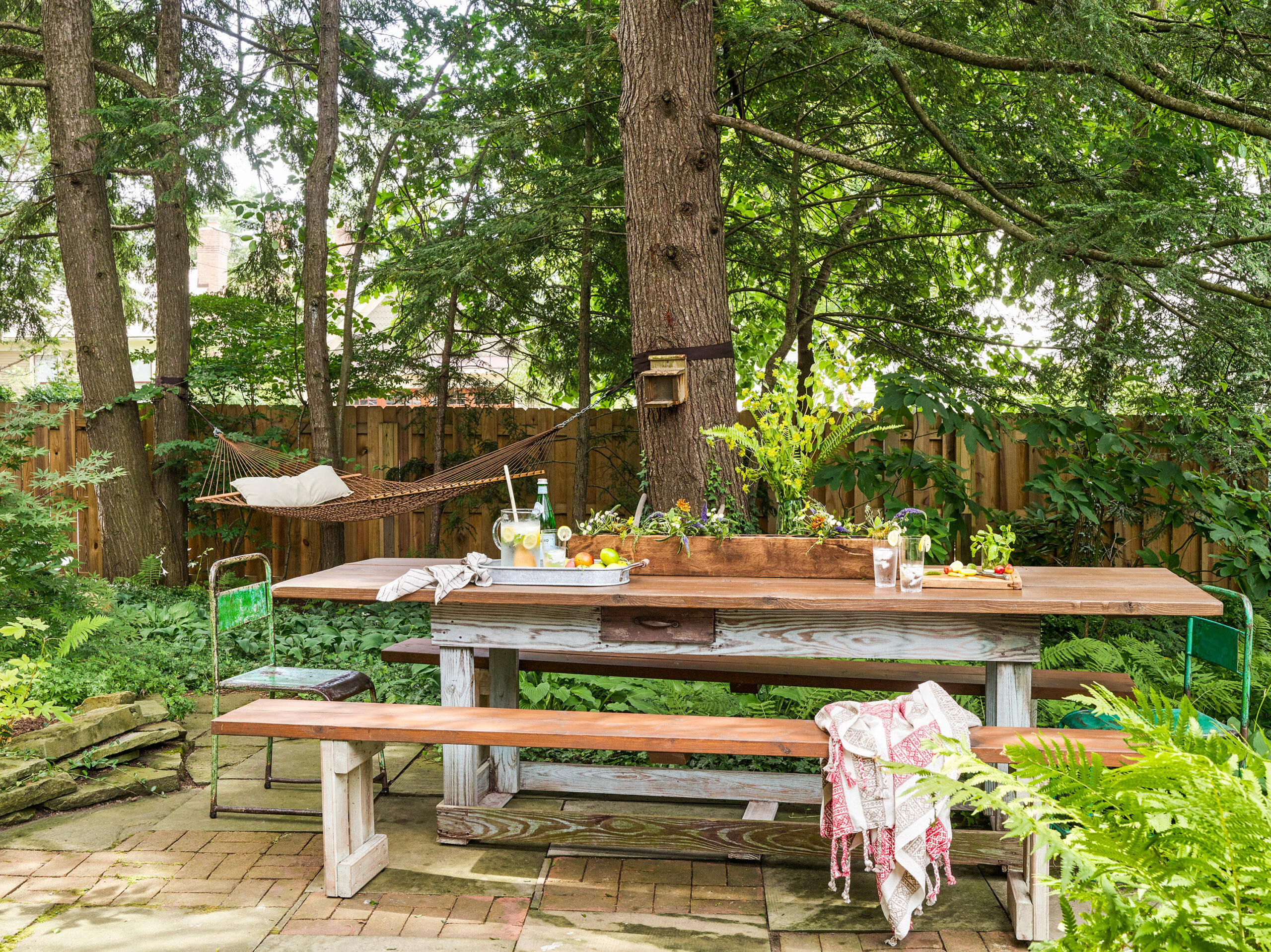 A table and benches on the patio.
