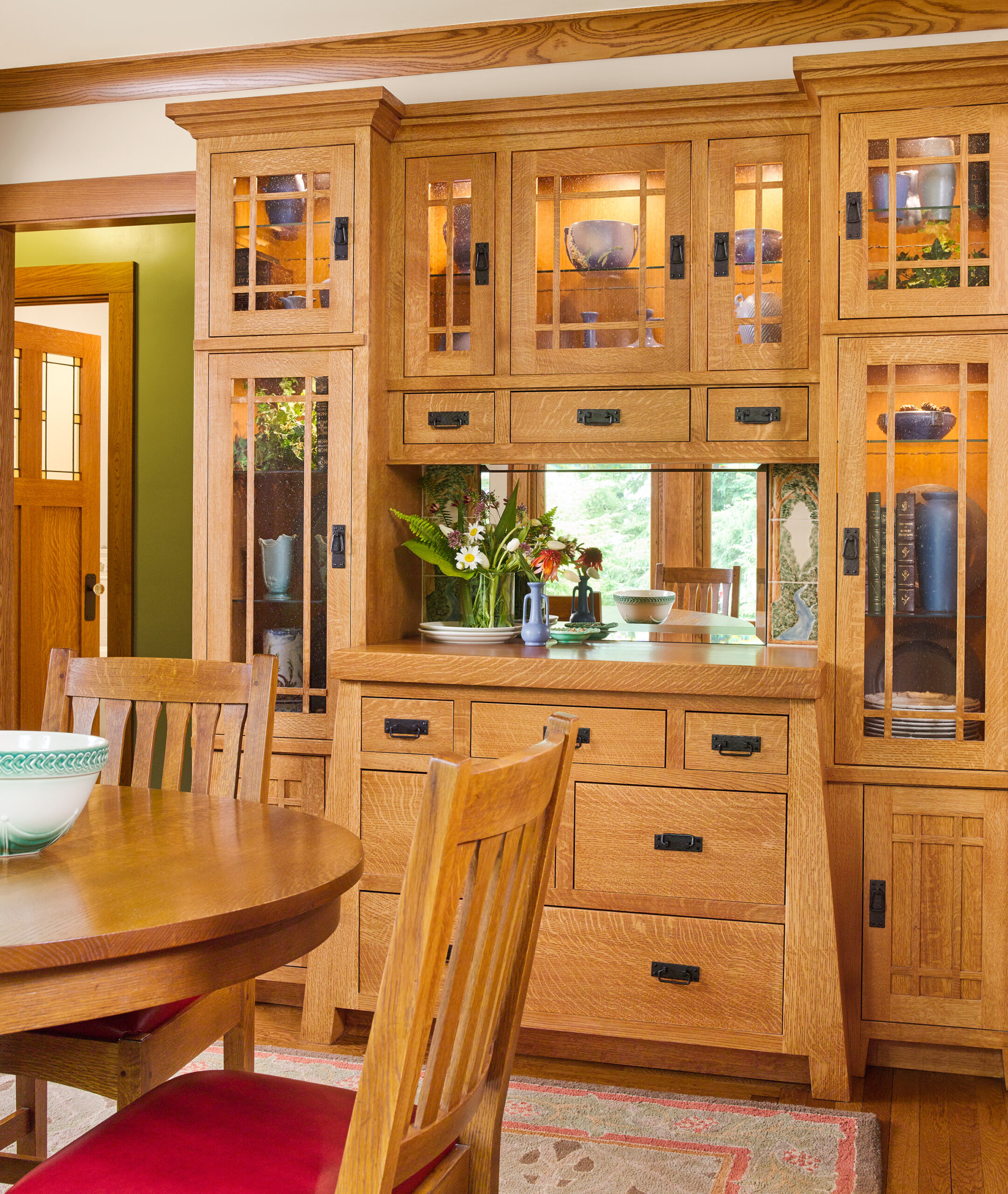Slanted-leg built-ins providing storage in the dining room.