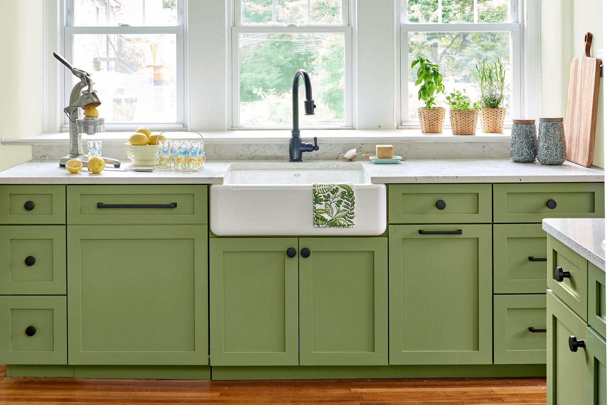 Green kitchen sink cabinets