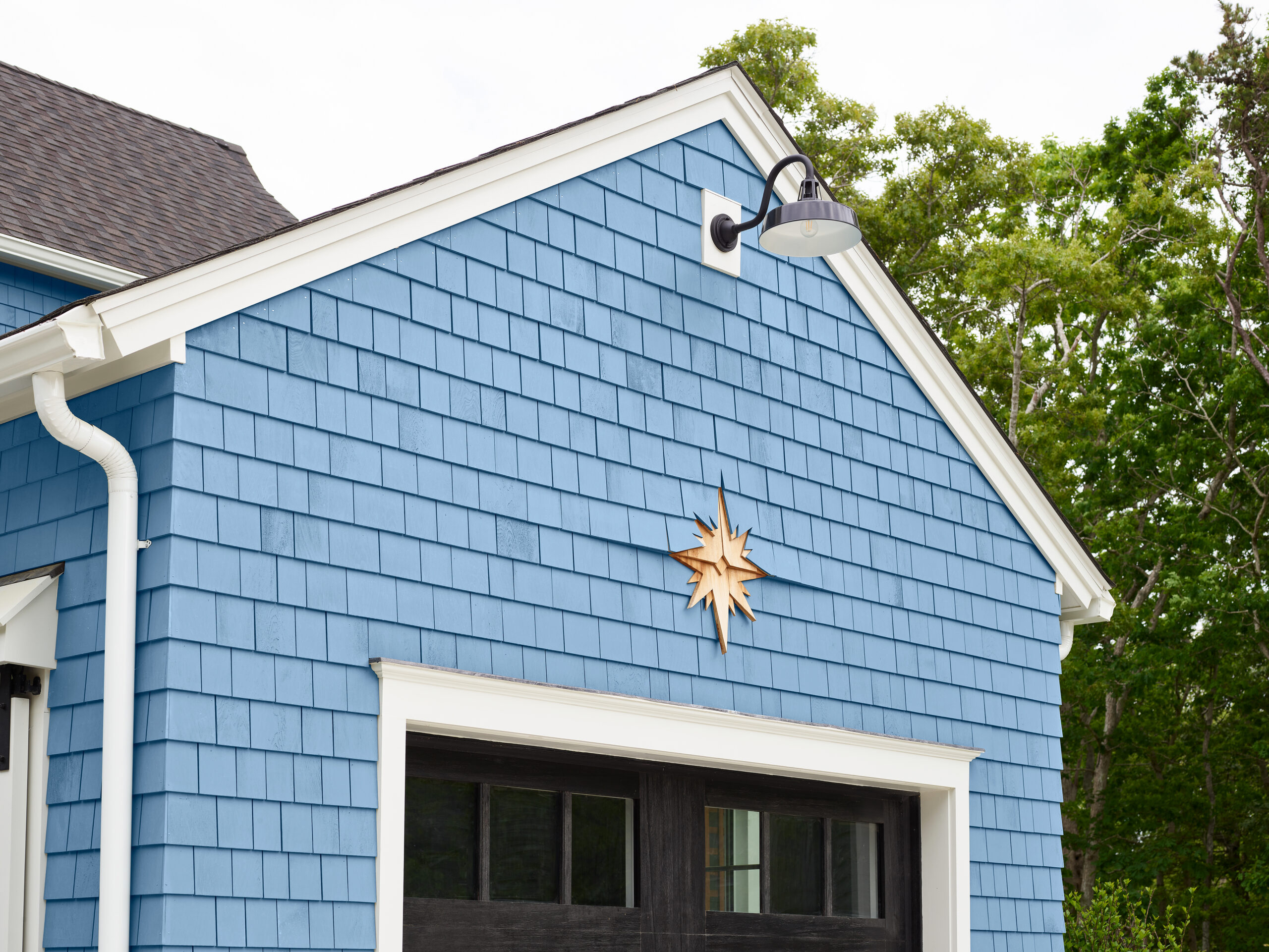 Blue cedar shingles on a house.