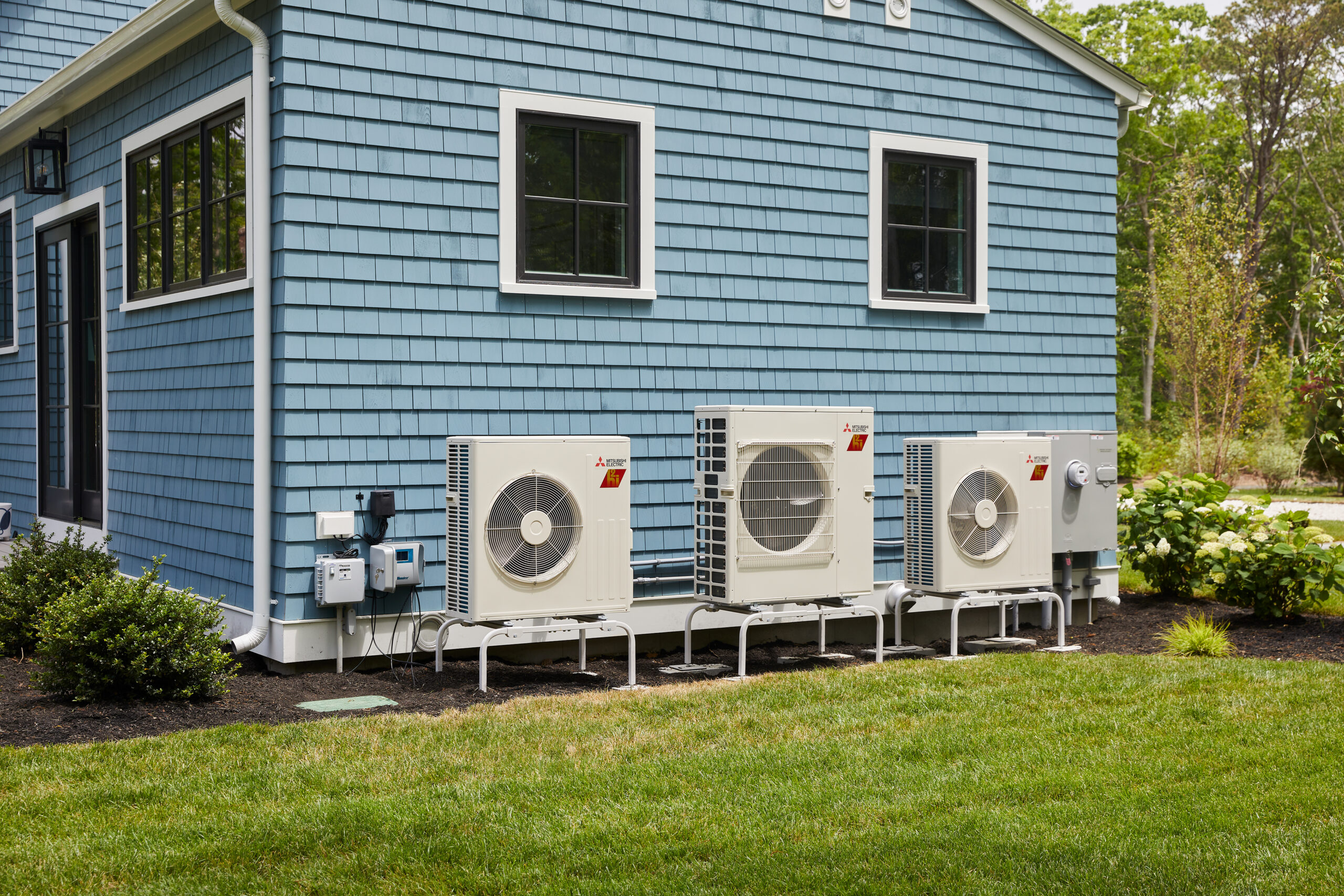 Three outdoor condensing units.