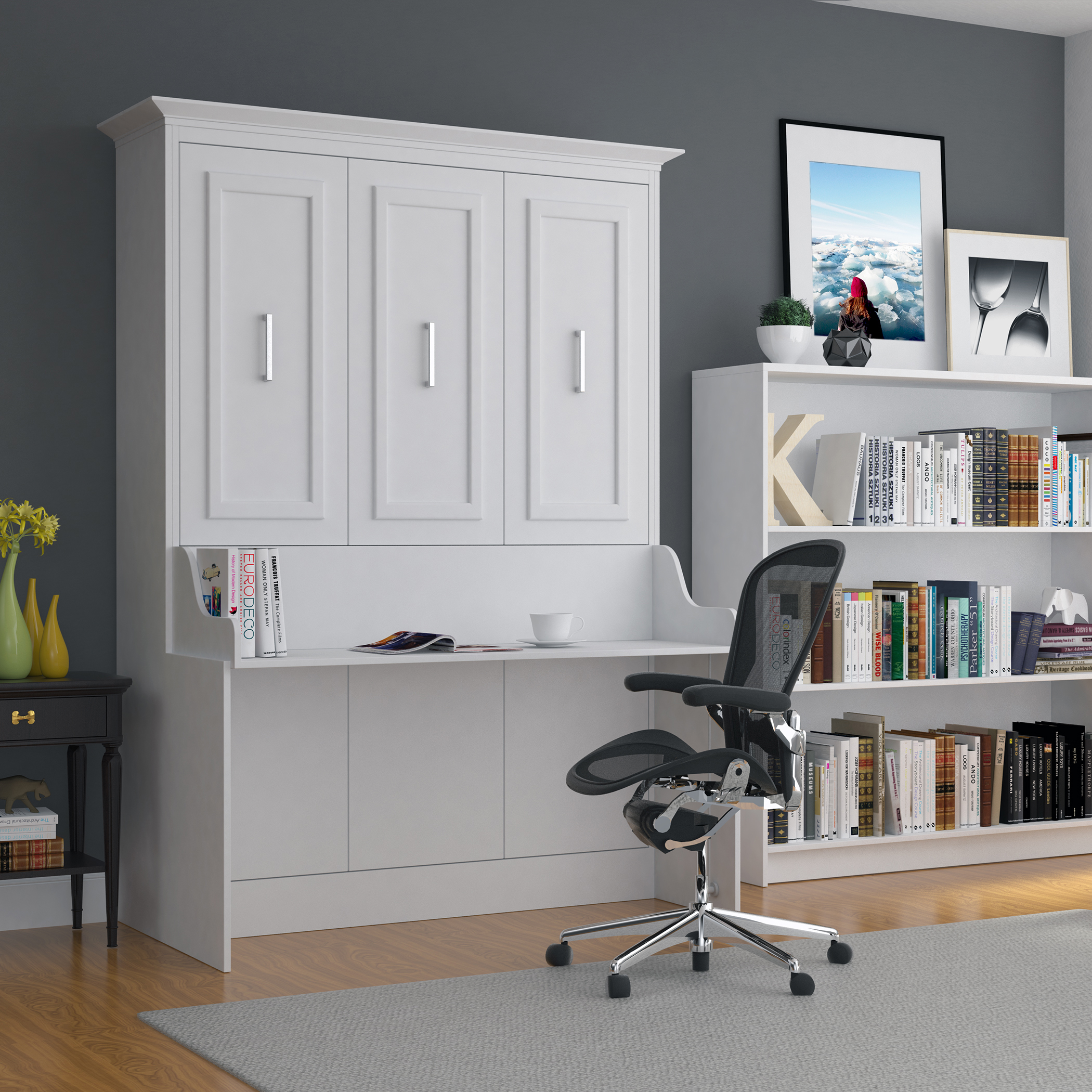 A murphy bed with a desk and cabinets.